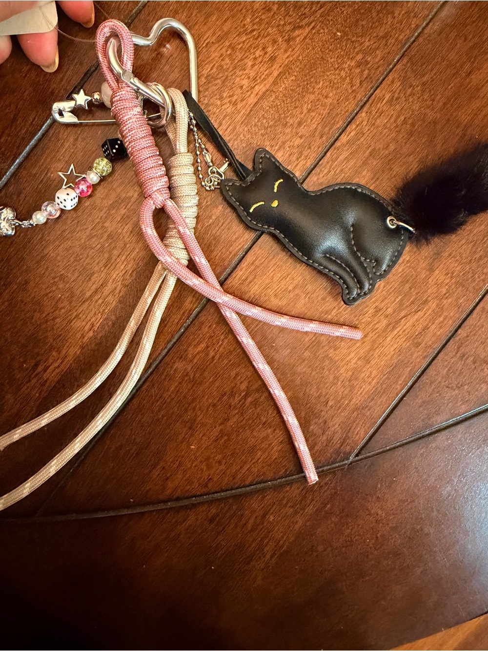Urban Outfitters Black Cat Keychain with Pink and Beige Cord Accents